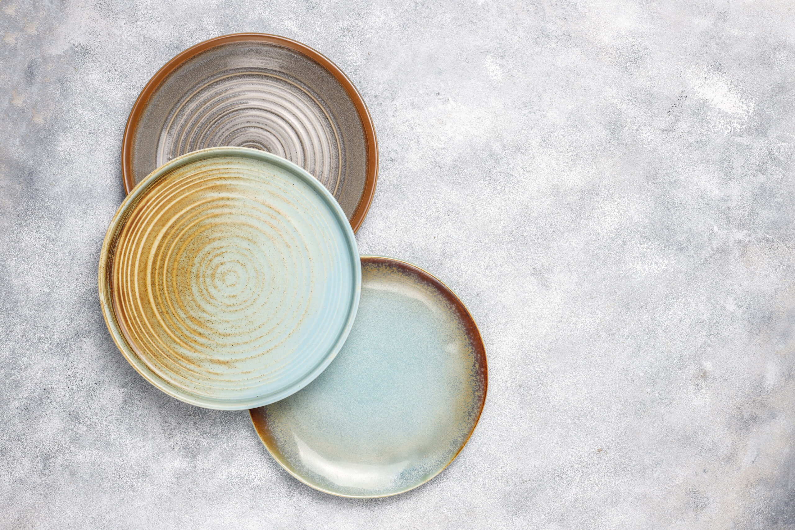 Different ceramic empty plates and bowls.